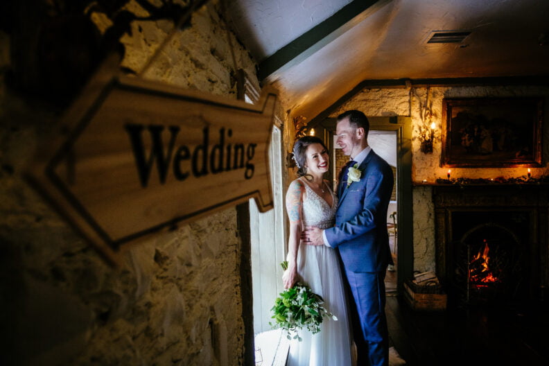 bride and groom embracing in anglers rest dublin following their civil wedding ceremony