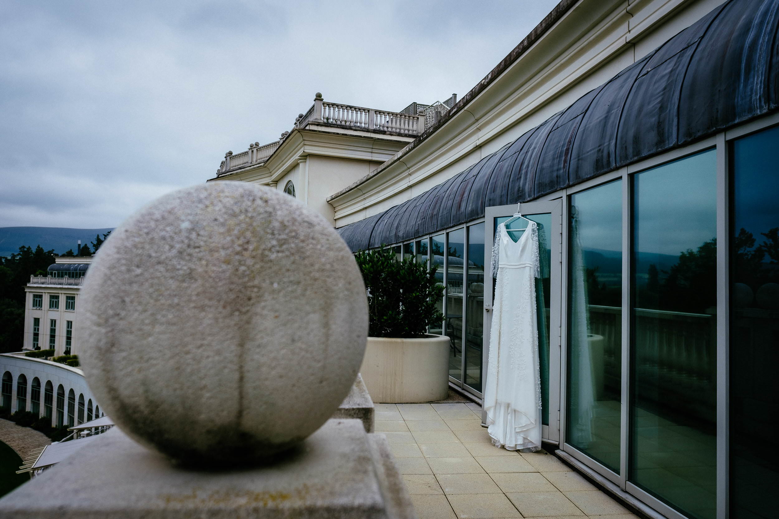 wedding dress hanging on a balcony at the Powerscourt Distillery