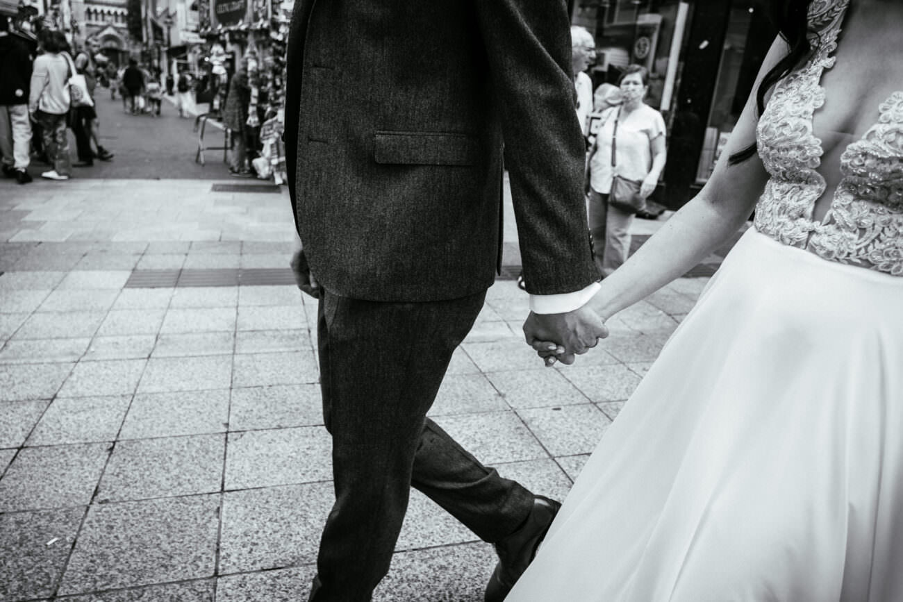 1 Beautiful Intimate Dublin City Wedding 89 bride and groom holding hands on dublin styreet