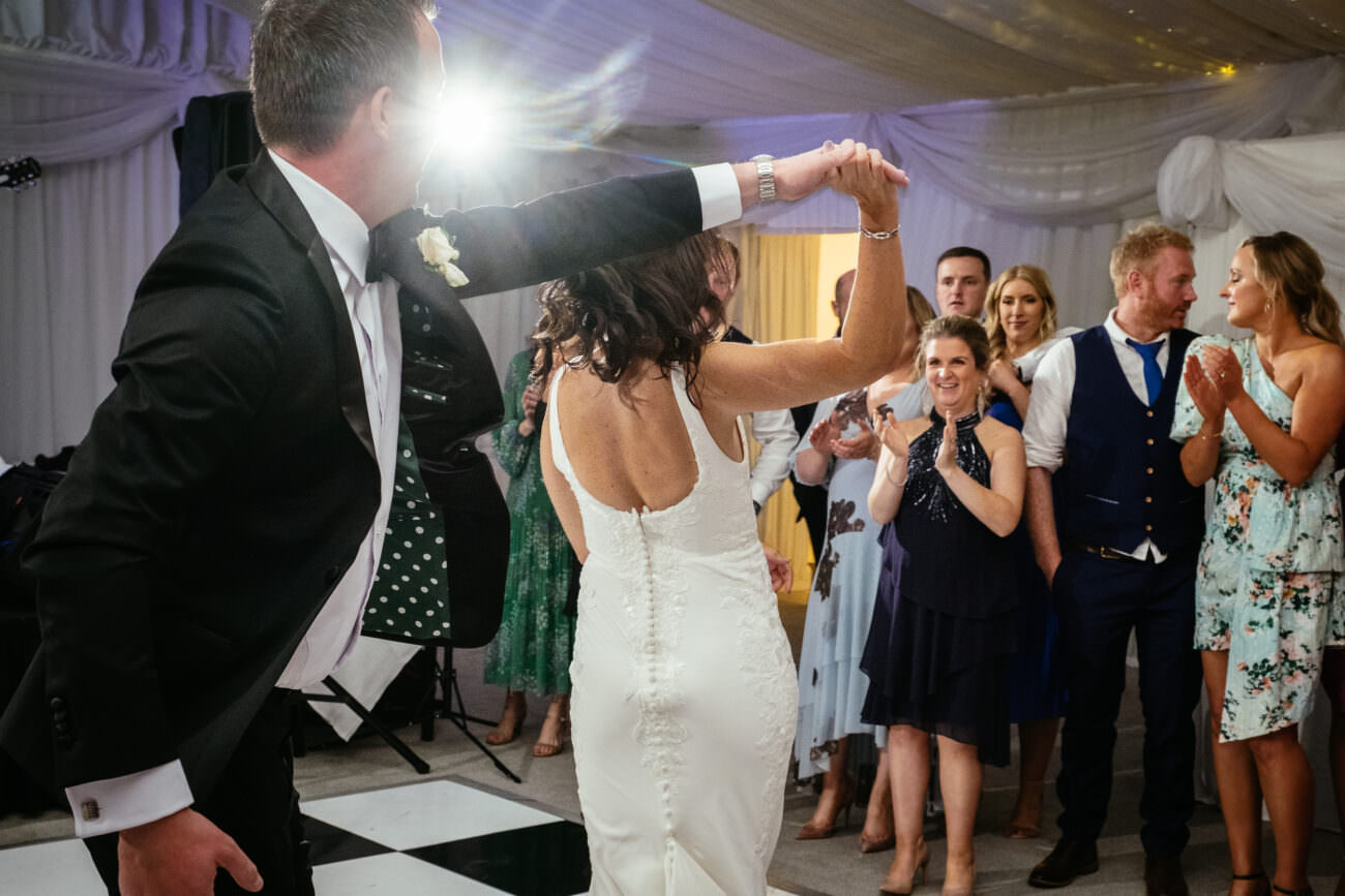 A bride and groom dancing at their wedding reception, held at Trump International Hotel Doonbeg.