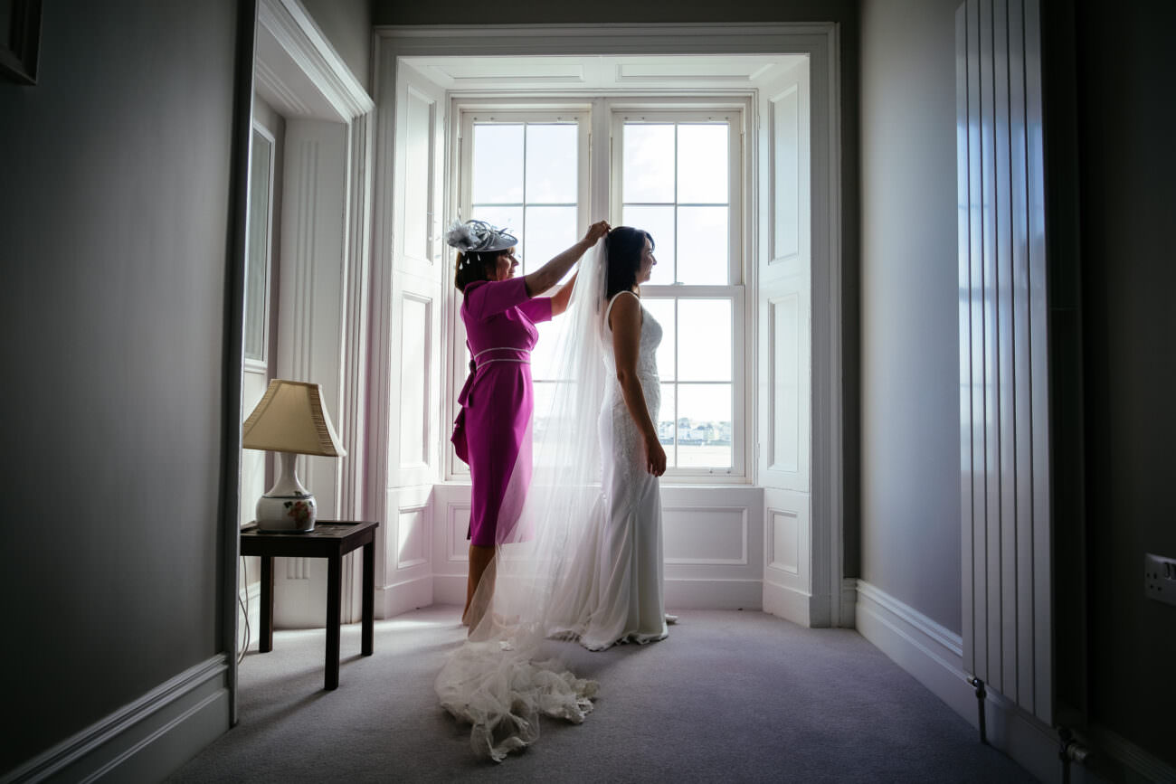 Bride getting ready with her mother in Kilkee on the morning of the wedding