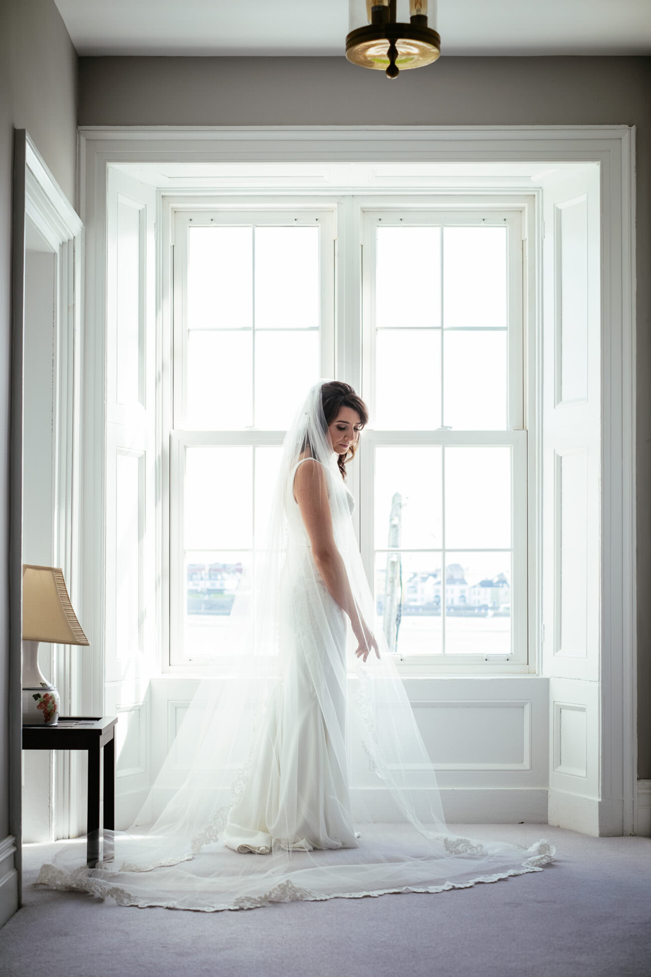 bride in window at Trump International Hotel Doonbeg Wedding