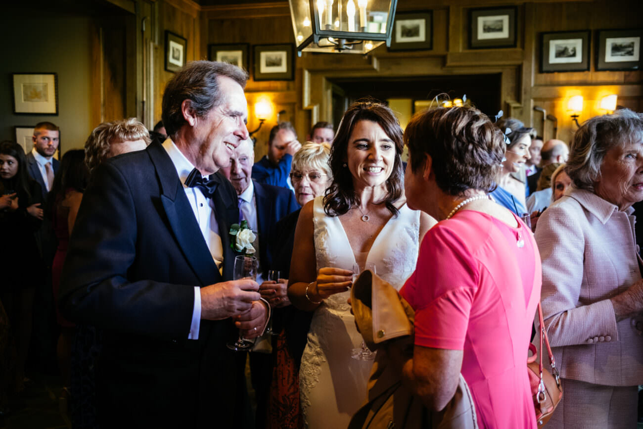 A bride and groom having an intimate conversation at their elegant wedding reception held at the luxurious Trump International Hotel Doonbeg.