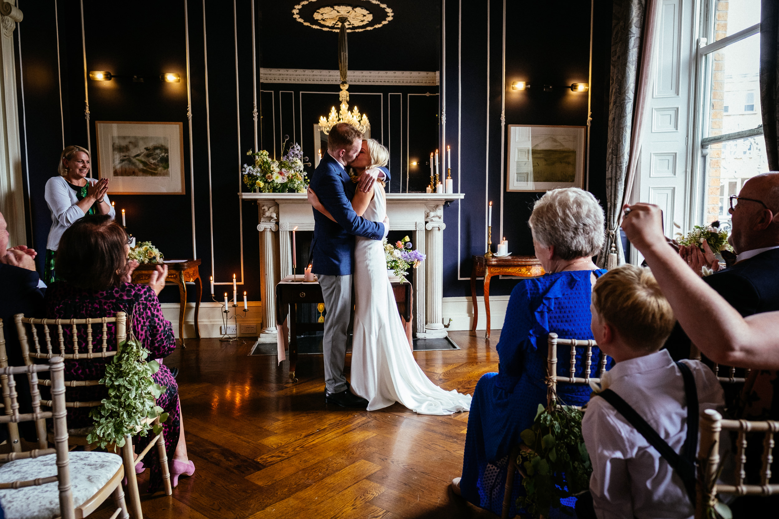 bride and groom having their first kiss during their Wedding at No. 25 Fitzwilliam Place