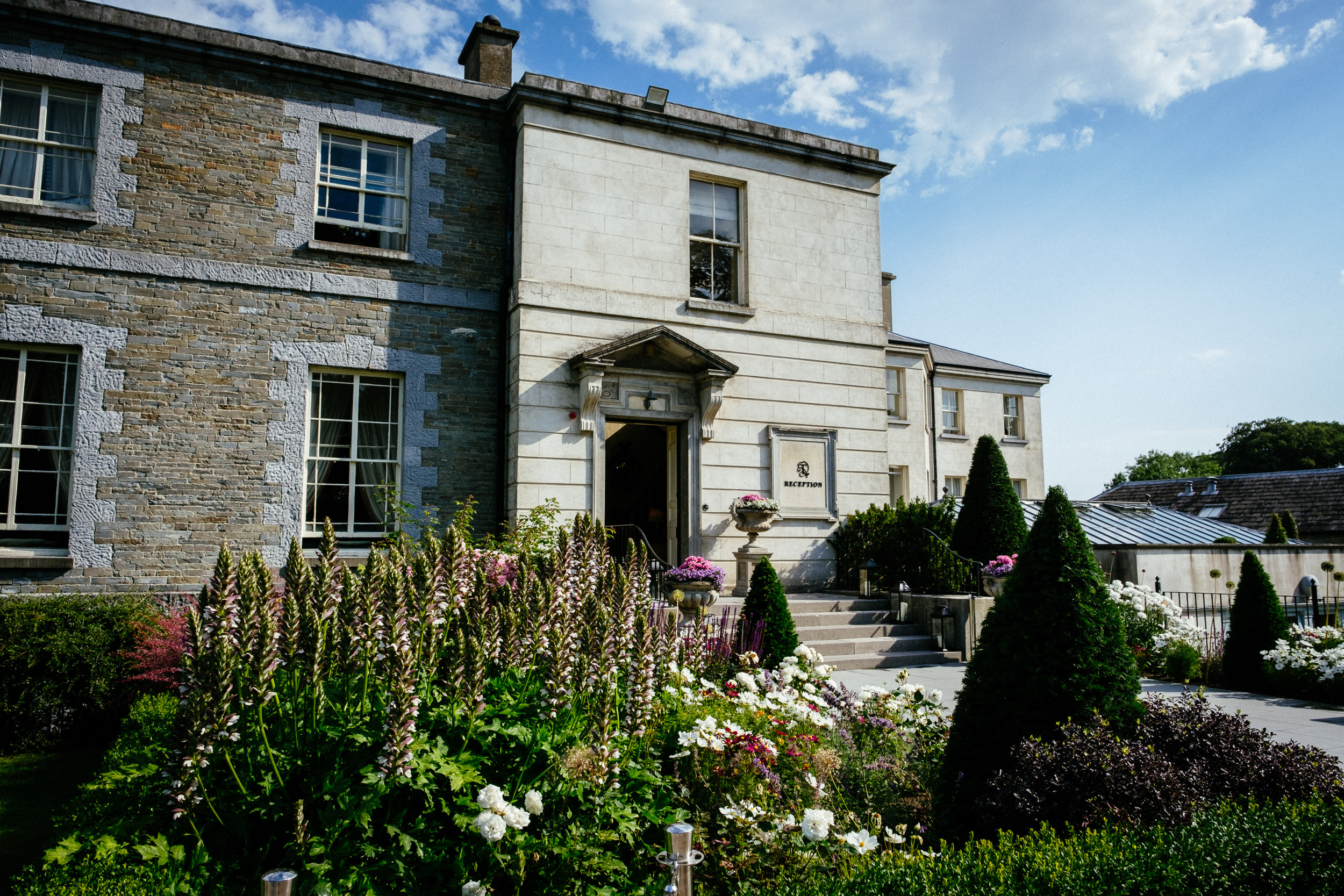 A picturesque garden in front of the majestic Tankardstown House, providing the perfect backdrop for a summer wedding.